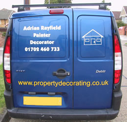 Image of blue van with sign writing