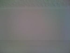 Photo of painted coving around ceiling line
